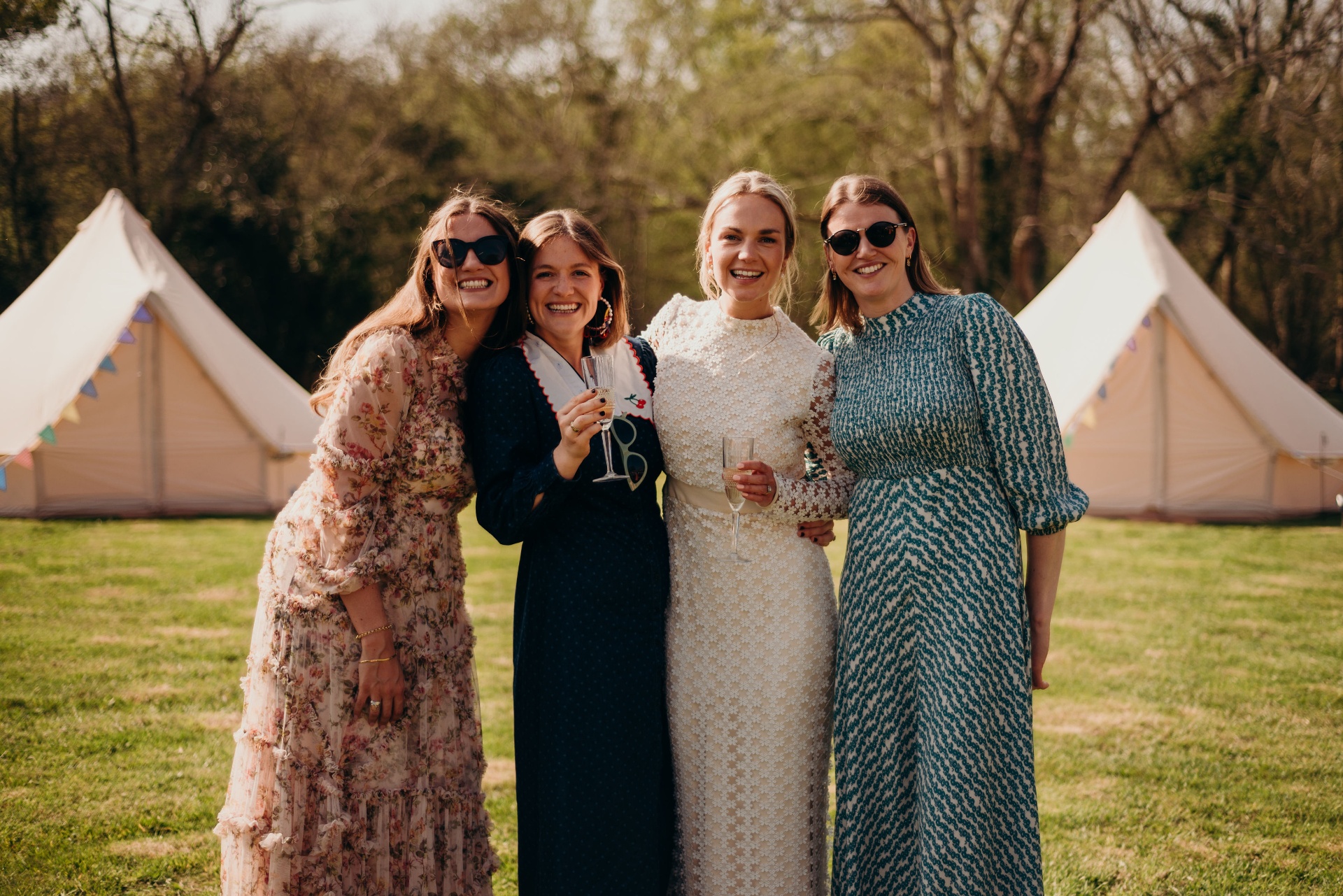 Bell tent village with guests at a Guernsey celebration