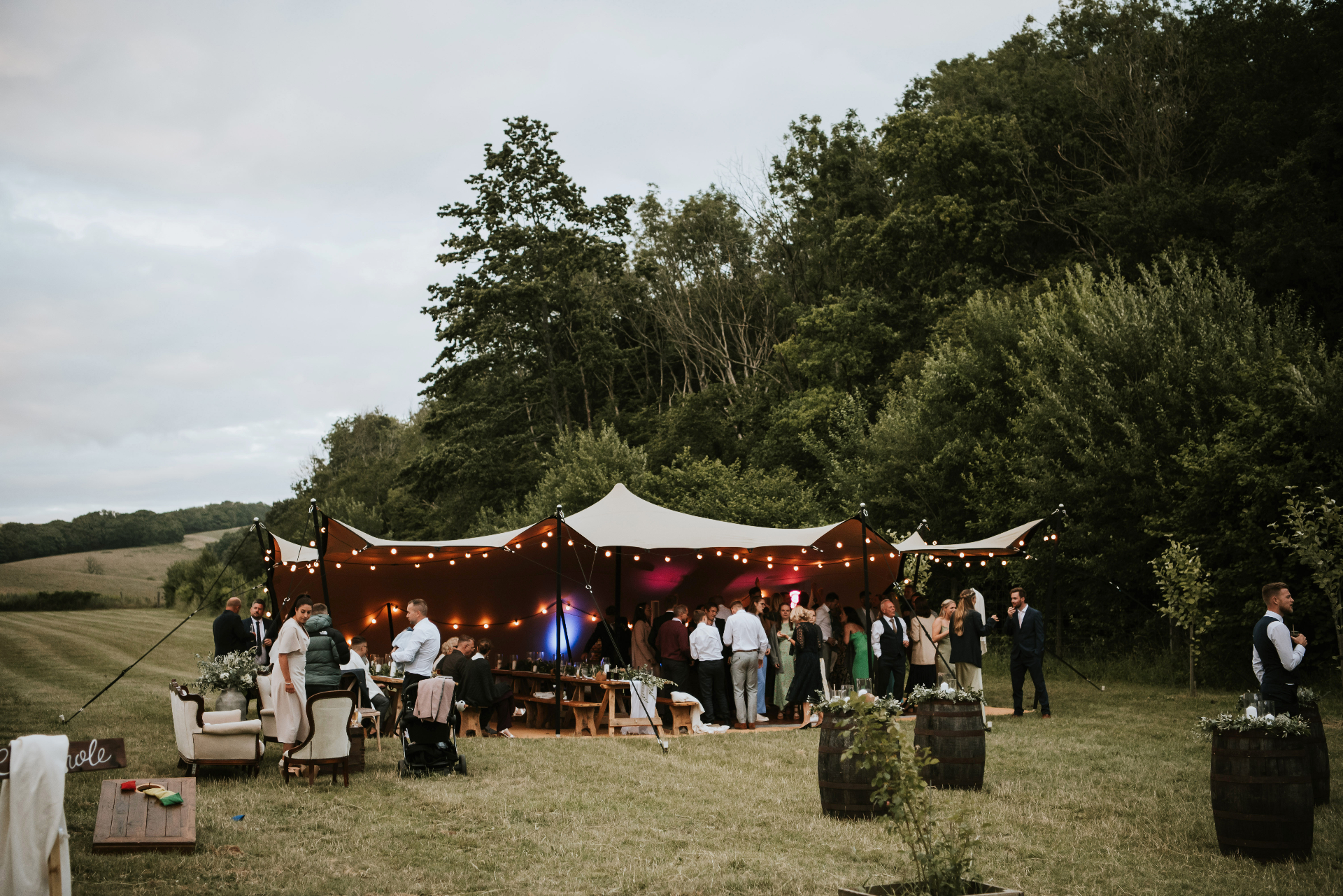 Stretch tent wedding reception at dusk